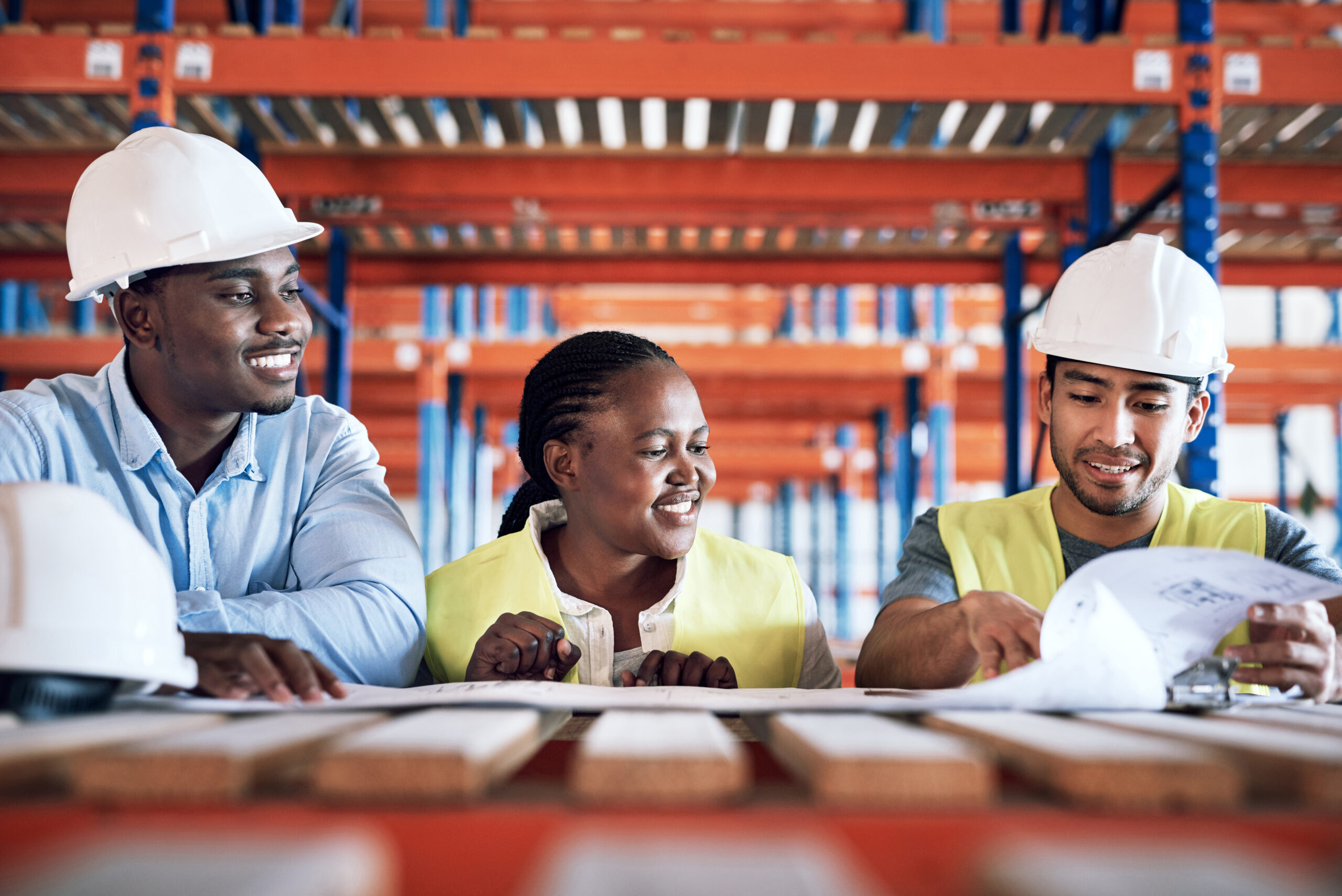 A group of builders having a meeting at a construction site.
